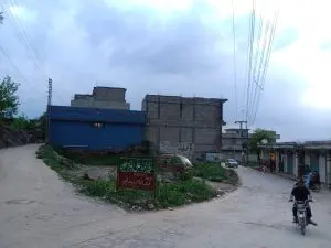 Exterior view of a single-story house with a wide street in Bani Gala.