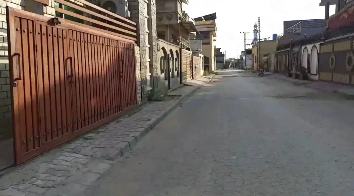 Gated homes along a clean street in Kainat Housing Colony, Rawalpindi