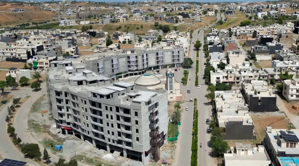 Under-construction commercial plaza and main boulevard in Umar Block Phase 8 Bahria Town